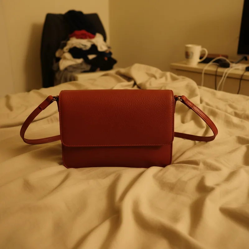 Red leather crossbody bag — original product photo before AI try-on