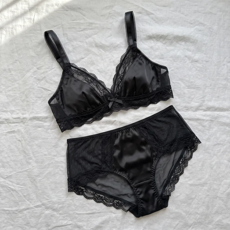 Black satin and mesh bralette set — the flat-lay product photo before try-on