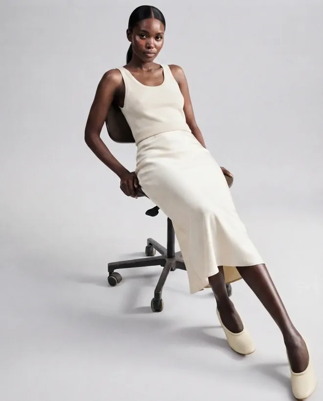 Office editorial — workwear shown where it is actually worn.
